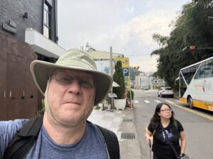 Two people walking along a road.