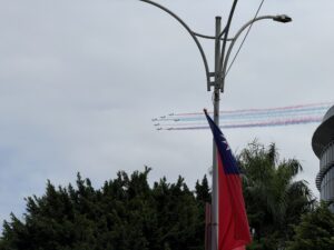 Taiwanese fighter jets in formation spreading multi-colored smoke